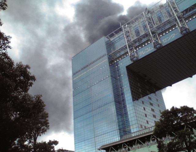 Black smoke rises from a burning building in Tokyo's Odaiba area in Tokyo Bay area after Japan was struck by a magnitude 8.9 earthquake off its northeastern coast Friday, March 11, 2011.